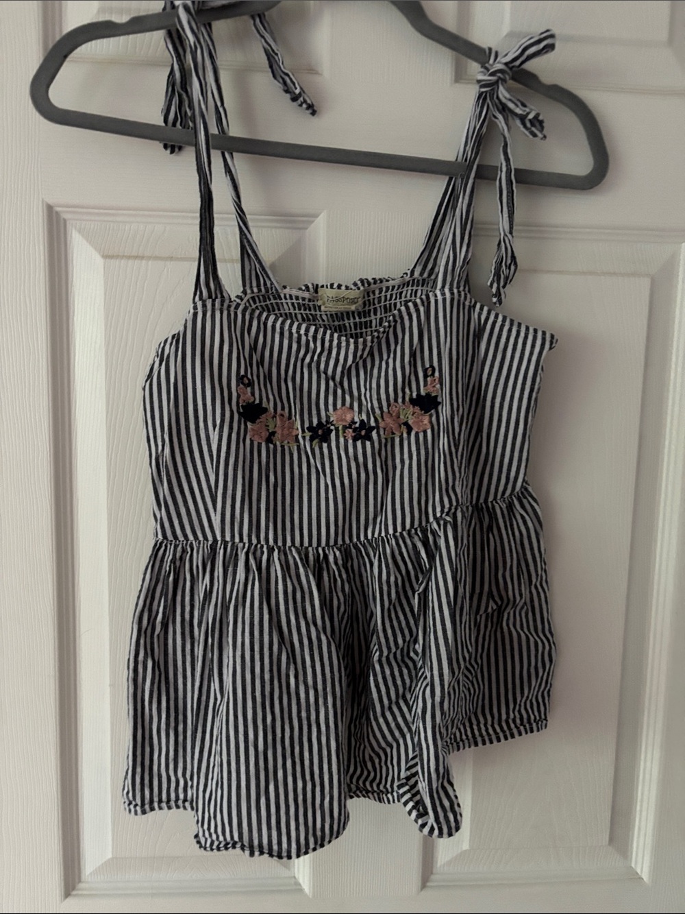 9. Passport Black and White Striped Tie-Shoulder Crop Top with Floral Embroidery